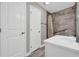 Well-lit bathroom featuring a tile shower with a grab bar, and a vanity with sink at 3641 Carriage Glen Way, Dacula, GA 30019