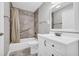 Modern bathroom featuring a shower-tub combo with grab bar, vanity with sink, and tiled floors at 3641 Carriage Glen Way, Dacula, GA 30019