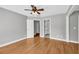 This bedroom features hardwood floors and two doorways at 3641 Carriage Glen Way, Dacula, GA 30019