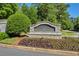 Stone entrance sign for Hamilton Mill at Ridge Brooke, surrounded by colorful landscaping at 3641 Carriage Glen Way, Dacula, GA 30019