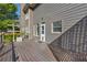 Exterior view of a wooden deck with railing, offering a relaxing outdoor space at 3641 Carriage Glen Way, Dacula, GA 30019