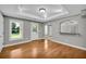 Dining room displaying hardwood floors, gray walls, white trim and natural light at 3641 Carriage Glen Way, Dacula, GA 30019