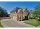 Beautiful brick two-story home with a well-manicured lawn and attached two car garage at 3641 Carriage Glen Way, Dacula, GA 30019