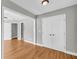 This hallway features hardwood floors and white trim at 3641 Carriage Glen Way, Dacula, GA 30019