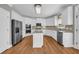 Bright kitchen with stainless steel appliances, white cabinets, granite countertops, and an island at 3641 Carriage Glen Way, Dacula, GA 30019
