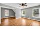 This living room features hardwood floors and lots of light at 3641 Carriage Glen Way, Dacula, GA 30019