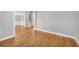 Open-concept living room with hardwood floors, perfect for entertaining and relaxing with Gathering at 3641 Carriage Glen Way, Dacula, GA 30019