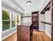 Organized walk-in closet features shelving, natural light from the window, and hardwood floor at 3641 Carriage Glen Way, Dacula, GA 30019