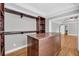 Walk-in closet with built-in dark wood shelving and storage, hardwood floors, and natural light at 3641 Carriage Glen Way, Dacula, GA 30019