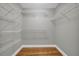 Spacious walk-in closet featuring hardwood floors and wire shelving at 3641 Carriage Glen Way, Dacula, GA 30019