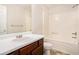 Bright bathroom with tub and shower and wood cabinets and silver faucet at 4795 Wilkins Station Dr, Decatur, GA 30035