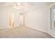 Spacious bedroom featuring neutral carpeting, vaulted ceiling, and bathroom access at 4795 Wilkins Station Dr, Decatur, GA 30035