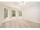 Bright bedroom with ample natural light from multiple windows and neutral carpeting at 4795 Wilkins Station Dr, Decatur, GA 30035