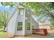 Charming two-story home with wood siding and a backyard deck at 4795 Wilkins Station Dr, Decatur, GA 30035