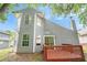 Charming two-story home with wood siding, chimney, and a backyard deck at 4795 Wilkins Station Dr, Decatur, GA 30035
