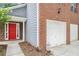 Attractive two-story home featuring a red door and brick and gray siding at 4795 Wilkins Station Dr, Decatur, GA 30035