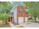 Beautiful two-story home with red brick, gray siding, and a bright red door at 4795 Wilkins Station Dr, Decatur, GA 30035