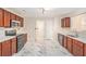 Spacious kitchen featuring modern appliances, white counters, and stylish marble-patterned flooring at 4795 Wilkins Station Dr, Decatur, GA 30035