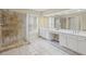 Primary bathroom featuring a stand up shower and abundant counter space with double vanity sinks at 1465 Laleiah Dr, Cumming, GA 30041