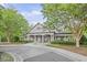 Charming clubhouse with elegant columns, manicured landscaping, and a welcoming entrance at 1465 Laleiah Dr, Cumming, GA 30041