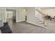 Welcoming foyer with staircase, light-colored walls, and access to multiple rooms at 1465 Laleiah Dr, Cumming, GA 30041