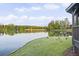 A peaceful lake view with geese, showcasing the community's beautiful natural surroundings and lakeside gazebo at 1465 Laleiah Dr, Cumming, GA 30041