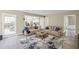 Spacious living room with an open layout leading to the kitchen, sofas, and natural light at 1465 Laleiah Dr, Cumming, GA 30041