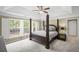 Main bedroom suite showcasing a four poster bed with an abundant amount of natural light at 1465 Laleiah Dr, Cumming, GA 30041