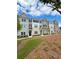 New townhomes in a community with sidewalks, landscaping and lawn at 1915 Cassia Aly, Kennesaw, GA 30144