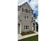 Attractive townhome with brick and siding exterior, complemented by manicured landscaping and inviting entranceways at 1915 Cassia Aly, Kennesaw, GA 30144