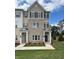 Charming townhome featuring a brick facade, complemented by dark shutters and a well-manicured lawn at 1915 Cassia Aly, Kennesaw, GA 30144