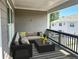 Stylish covered patio with comfortable seating, perfect for relaxing and enjoying the outdoors at 1915 Cassia Aly, Kennesaw, GA 30144