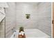 Soaking tub in a modern bathroom with stylish tile and decor at 640 Glen Iris Ne Dr # 609, Atlanta, GA 30308