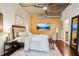 Comfortable bedroom with hardwood floors, a ceiling fan, and an ensuite bathroom at 640 Glen Iris Ne Dr # 609, Atlanta, GA 30308