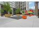 Modern courtyard with art, seating, and landscaping is ideal for relaxing and recreation at 640 Glen Iris Ne Dr # 609, Atlanta, GA 30308