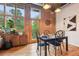 Dining area with exposed brick, modern lighting, and access to a small balcony at 640 Glen Iris Ne Dr # 609, Atlanta, GA 30308