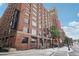 Beautiful brick exterior of the building with large windows and retail space at street level at 640 Glen Iris Ne Dr # 609, Atlanta, GA 30308