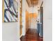 Hallway featuring wooden floors, glass shelving, and modern light fixtures at 640 Glen Iris Ne Dr # 609, Atlanta, GA 30308