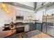 Well-lit kitchen with modern appliances, granite countertops and two-tone cabinets at 640 Glen Iris Ne Dr # 609, Atlanta, GA 30308