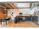 Modern kitchen with stainless steel appliances, dark countertops and a dining area at 640 Glen Iris Ne Dr # 609, Atlanta, GA 30308