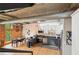 Stylish kitchen with stainless appliances, two-tone cabinets, granite countertops, and exposed ductwork near the dining area at 640 Glen Iris Ne Dr # 609, Atlanta, GA 30308