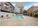 Inviting pool area with a spa, surrounded by a patio and seating, perfect for relaxation and entertainment at 640 Glen Iris Ne Dr # 609, Atlanta, GA 30308