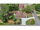 Aerial view of a home in wooded suburban neighborhood with a private backyard patio at 6510 Newcastle Way, Cumming, GA 30040
