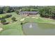 Aerial view of neighborhood clubhouse, golf course and lake at 6510 Newcastle Way, Cumming, GA 30040