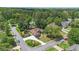 Aerial view of the house and neighborhood showing mature trees and professional landscaping at 6510 Newcastle Way, Cumming, GA 30040