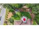 Aerial view of the backyard featuring a fire pit, seating, bench, and patio with a red umbrella at 6510 Newcastle Way, Cumming, GA 30040
