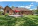 Lovely backyard with a patio, seating, and landscaping features at 6510 Newcastle Way, Cumming, GA 30040