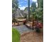 Relaxing backyard featuring a wooden swing, hammock, and lush landscaping at 6510 Newcastle Way, Cumming, GA 30040