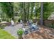 Outdoor seating area featuring Adirondack chairs around a fire pit and gravel at 6510 Newcastle Way, Cumming, GA 30040