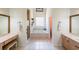 Bright bathroom with tile floors, vanity, soaking tub, and walk-in shower at 6510 Newcastle Way, Cumming, GA 30040